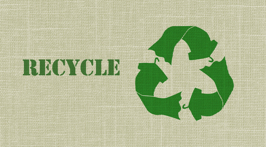 Recycle symbol on burlap bag